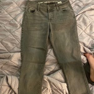 Dark grey washed mid-rise skinny jeans.